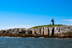 Pond Island Lighthouse Stationed Above Rocky Cliffs